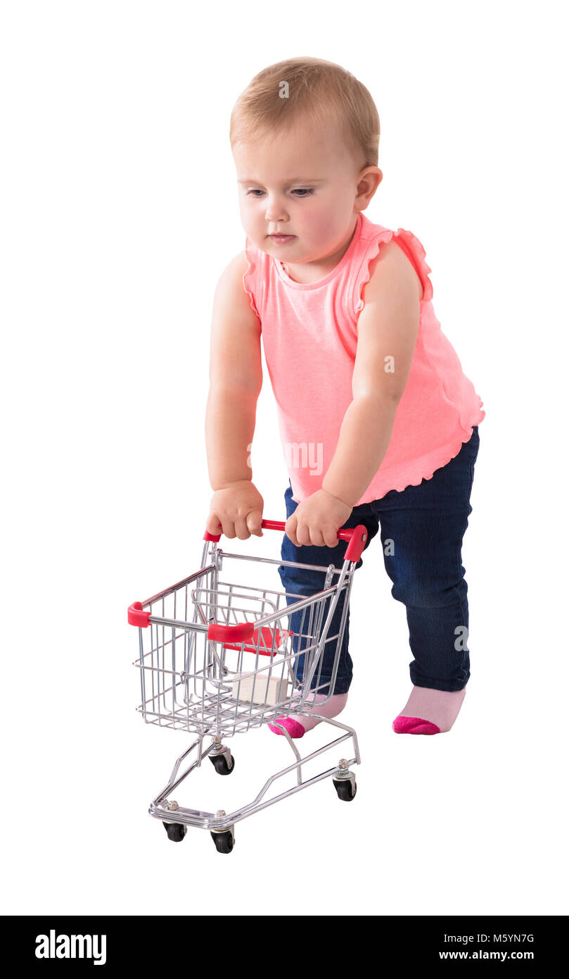 Baby Girl Holding Small Shopping Cart On White Background Stock Photo