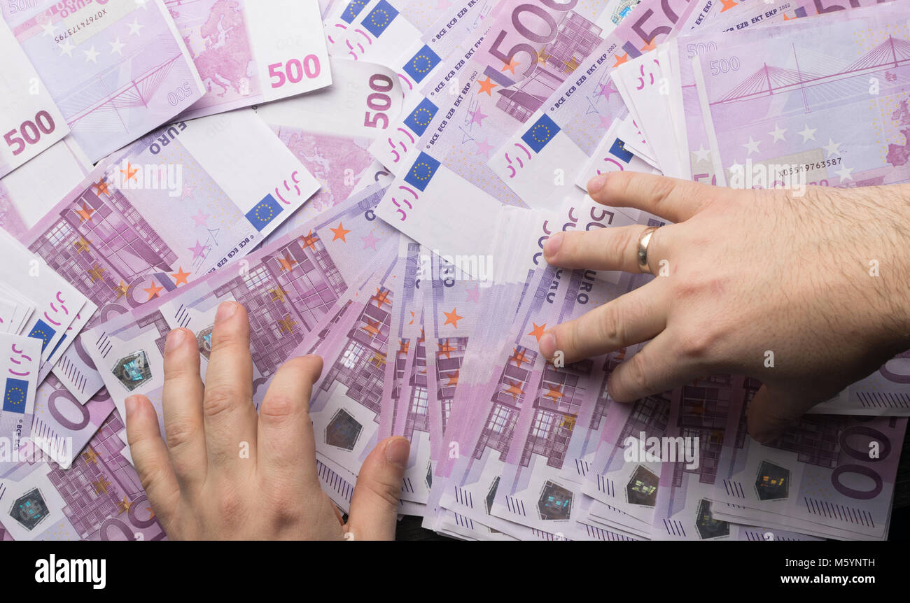 Big amount of Five hundred notes of European Union Currency. Man put ...