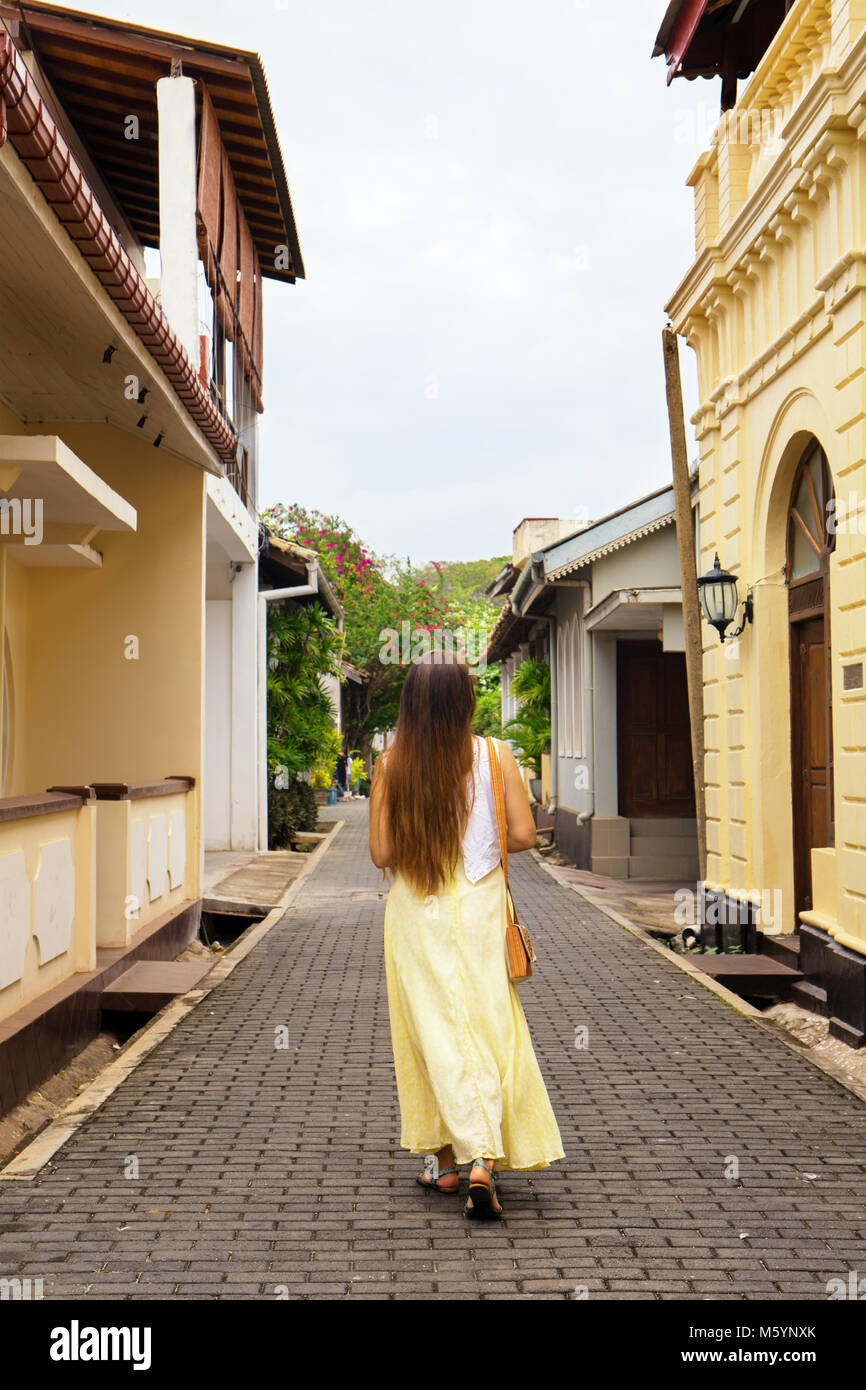 A woman strolls through the ancient city of Halle, Sri Lanka Stock Photo