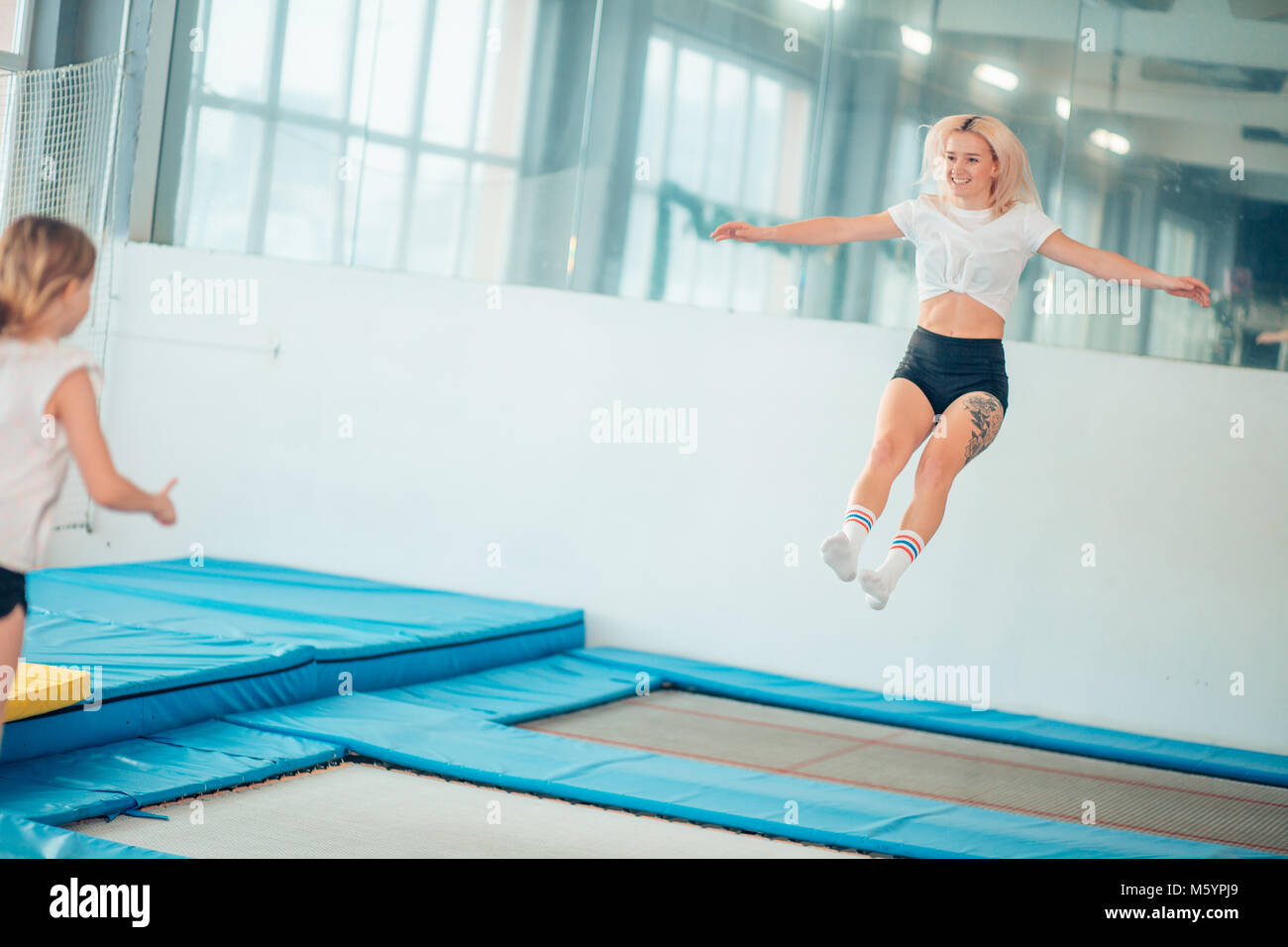 Woman trampoline gym hi-res stock photography and images - Alamy