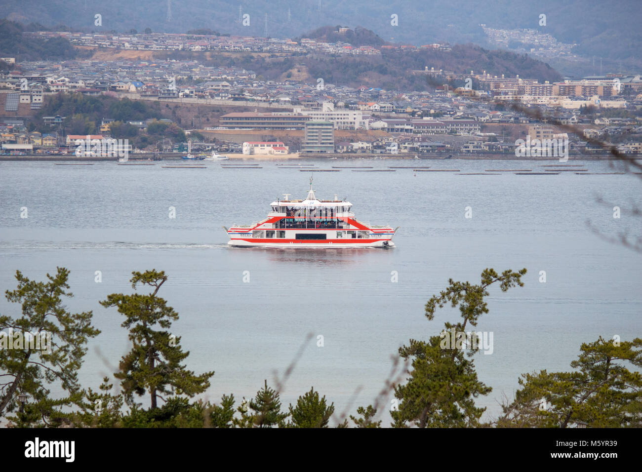 The ferry crossing the bay of Hiroshima to Miyajima Stock Photo