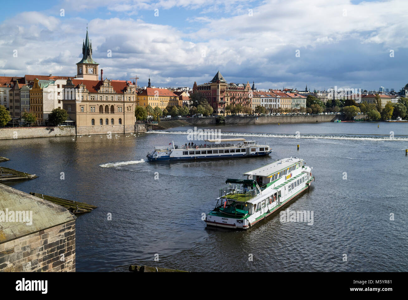 Prague; Czech Republic - October, 6, 2017: Classic Czech buildings and Smetana Museum along the Vltava River in Prague Stock Photo