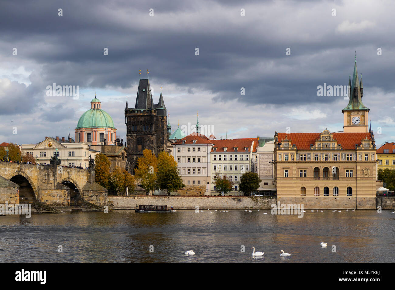 Prague, Czech Republic - October 9, 2017: Classic Czech buildings and Smetana Museum along the Vltava River in Prague in autumn Stock Photo