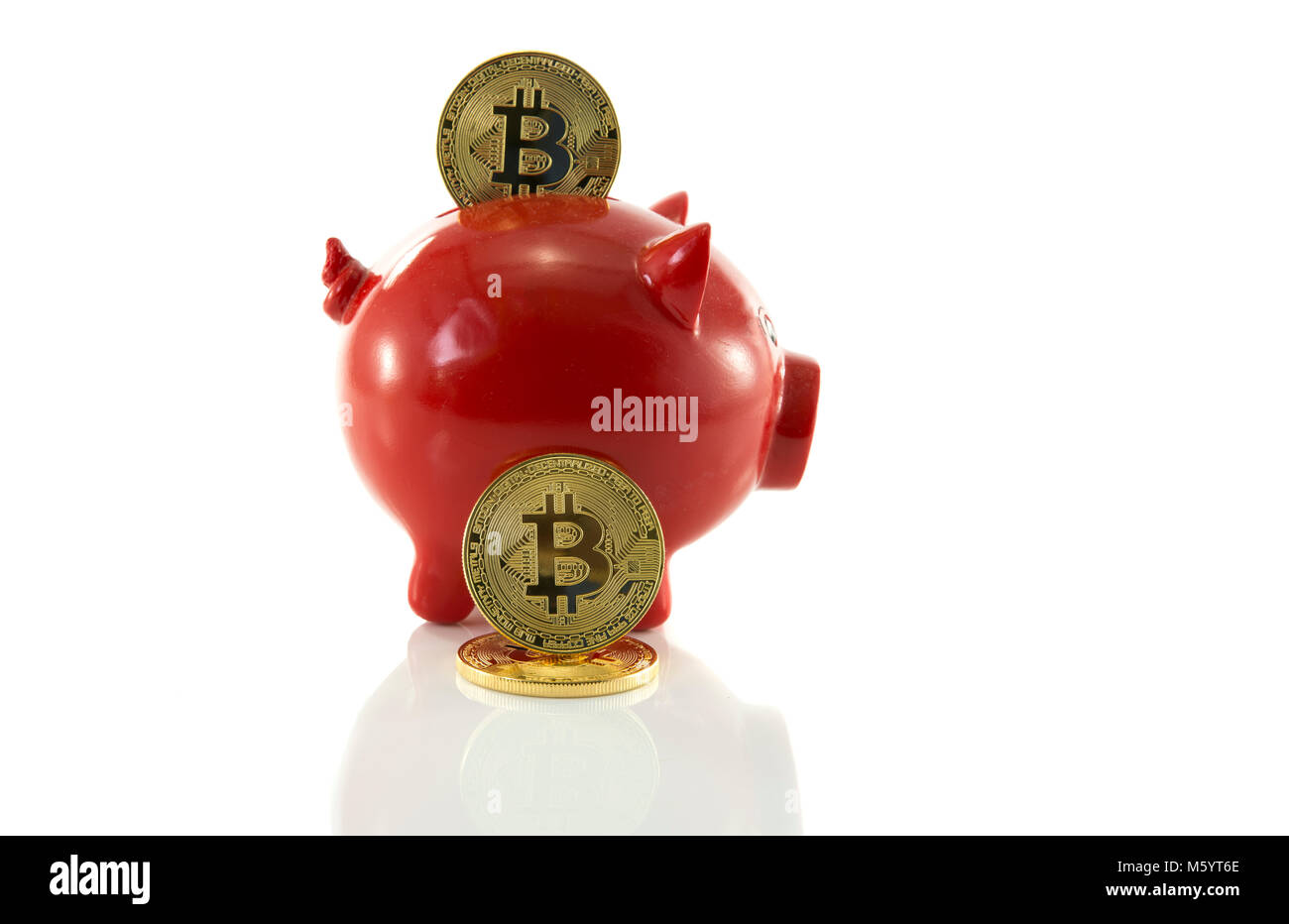 saving bit coins in money pig Stock Photo