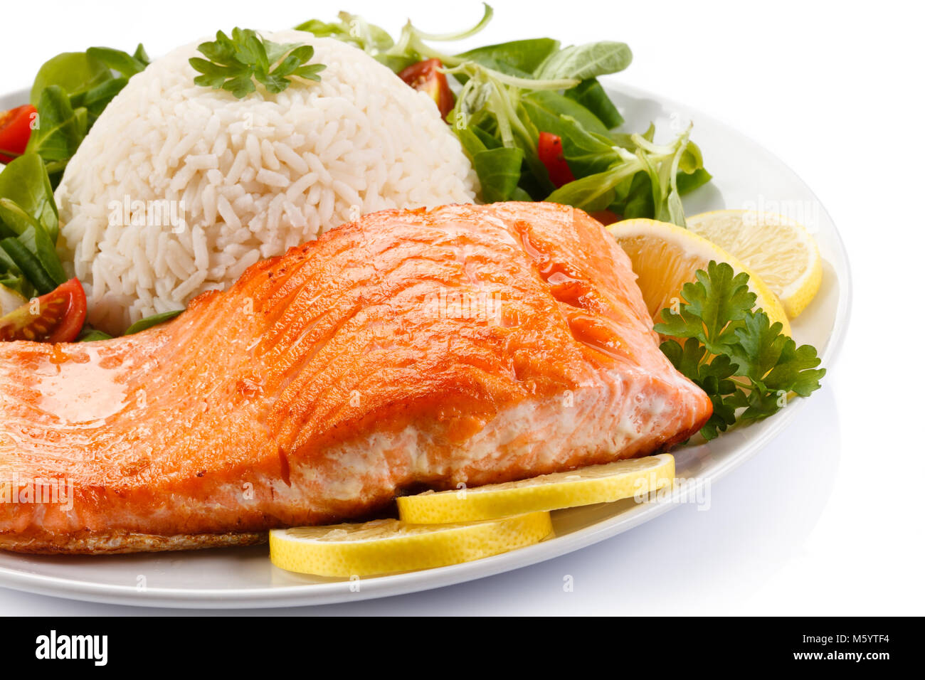 Roasted salmon, rice and vegetables on white background Stock Photo Alamy