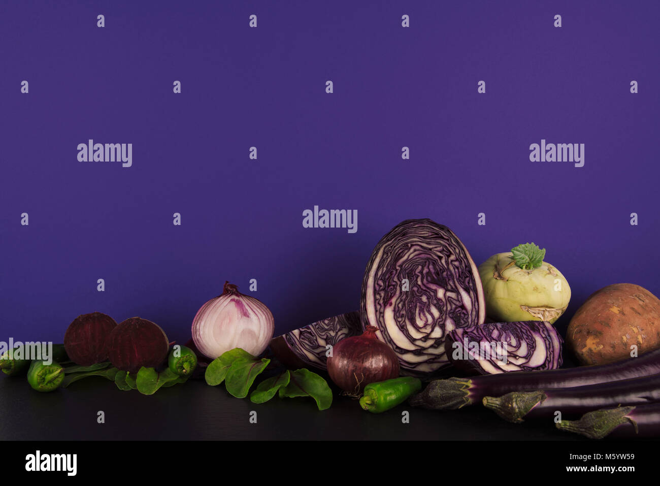 Assortment of raw organic violet vegetables. Stock Photo