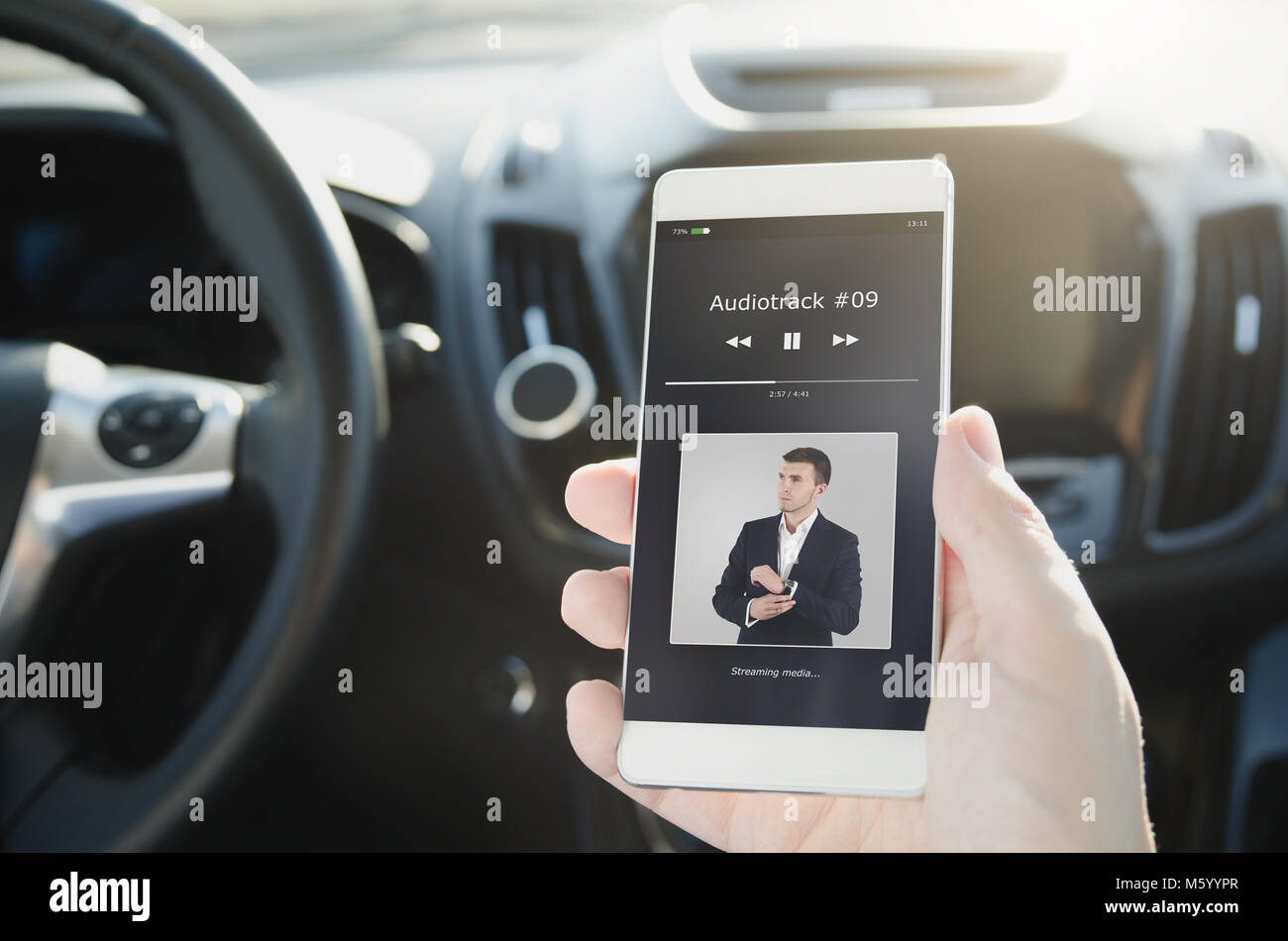 Listening music. Smart phone connected to car audio system. Music player car smart phone wireless connection comfortable concept Stock Photo
