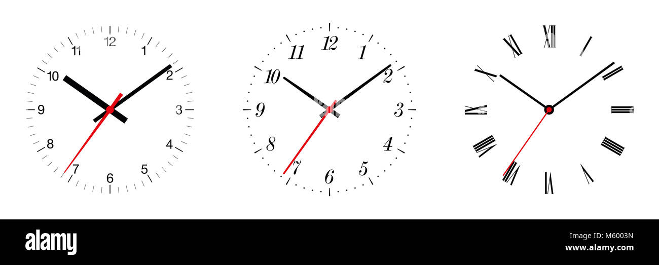 Three different clock faces over white, with regular, italic and fraktur numerals. Part of an analog clock, or watch. Displays the time. Stock Photo