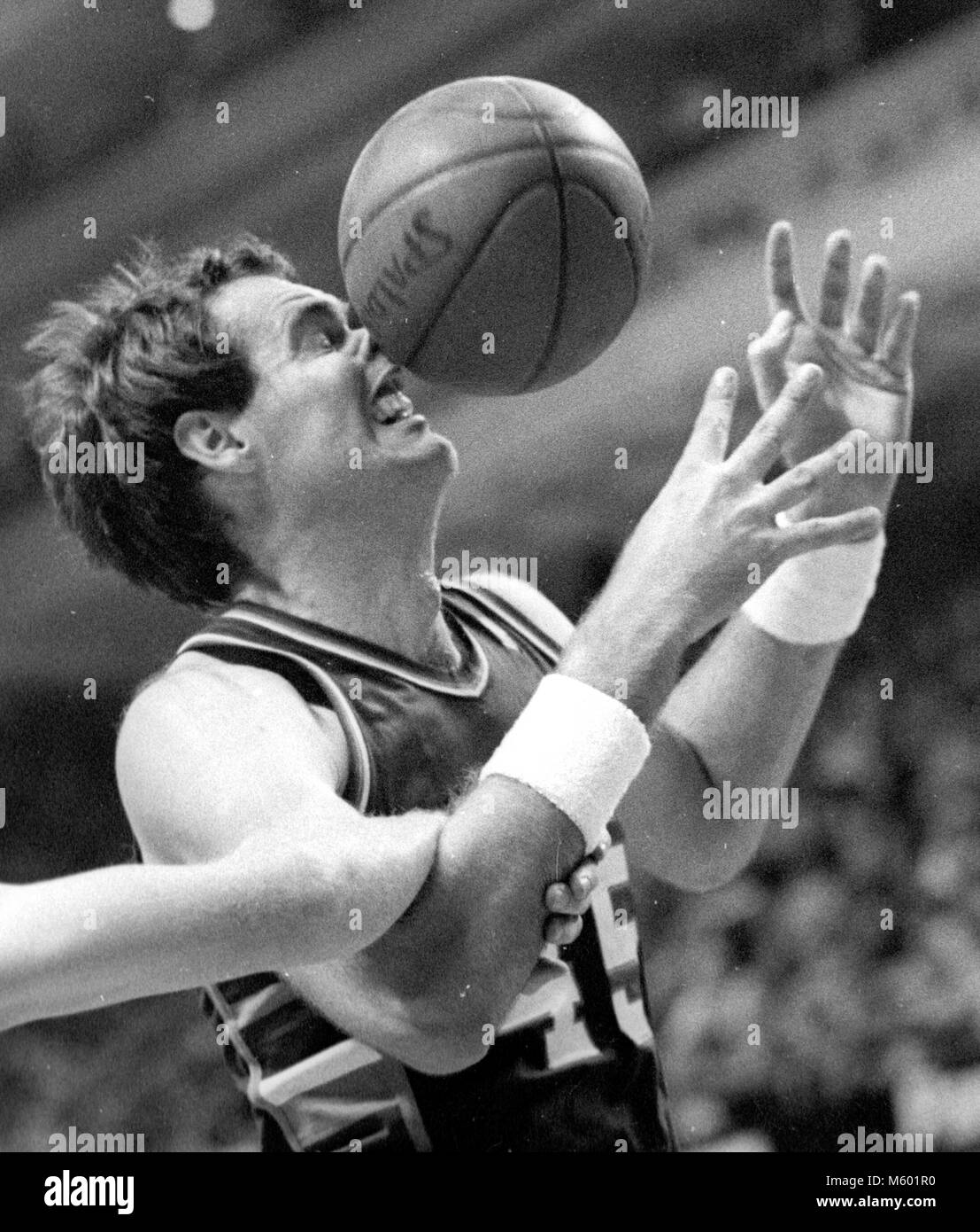 Milwaukee Bucks Randy Breuer has  ball slammed into his face while being fouled by Boston Celtics Danny Ainge in game action in the Boston Garden in Boston Mass USA photo by bill belknap photo won First Place Sports Action 1987 Boston Press Photographers  Assoc Stock Photo