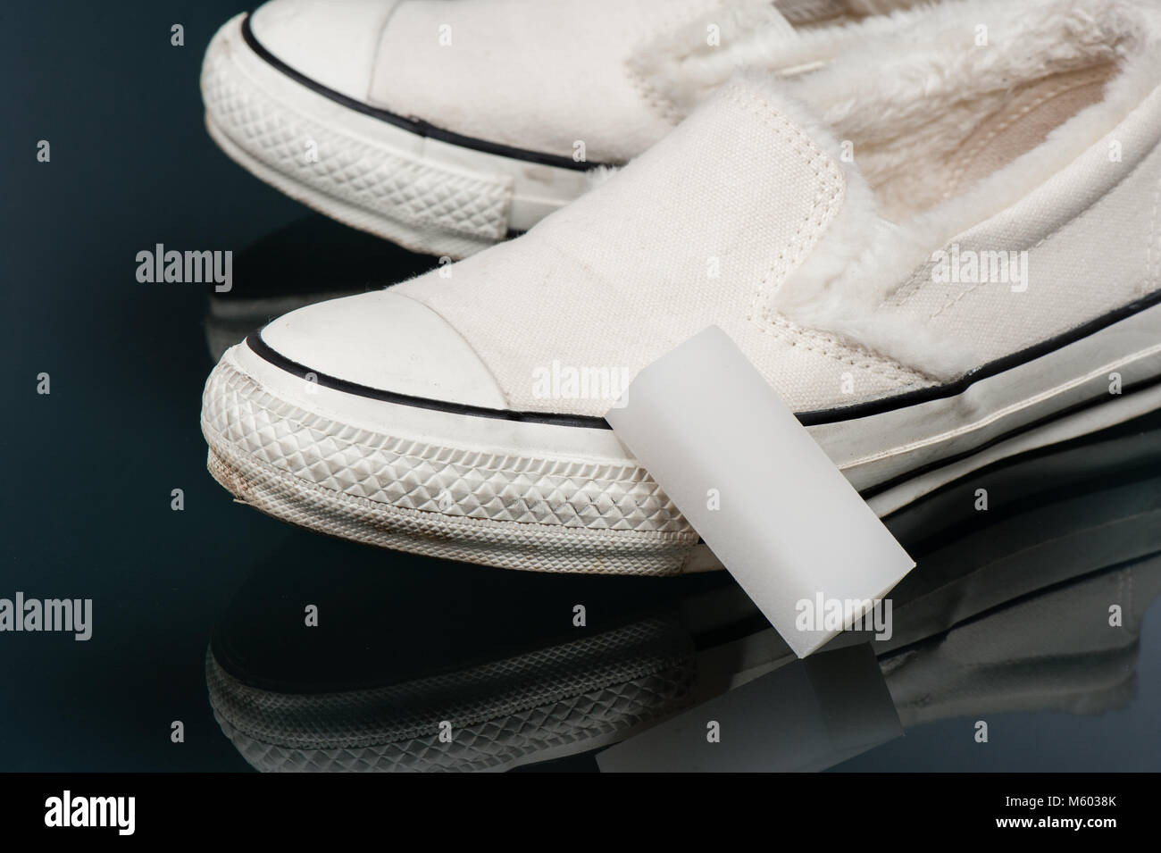 cleaning white canvas sneakers with canvas sneakers cleaner Stock Photo