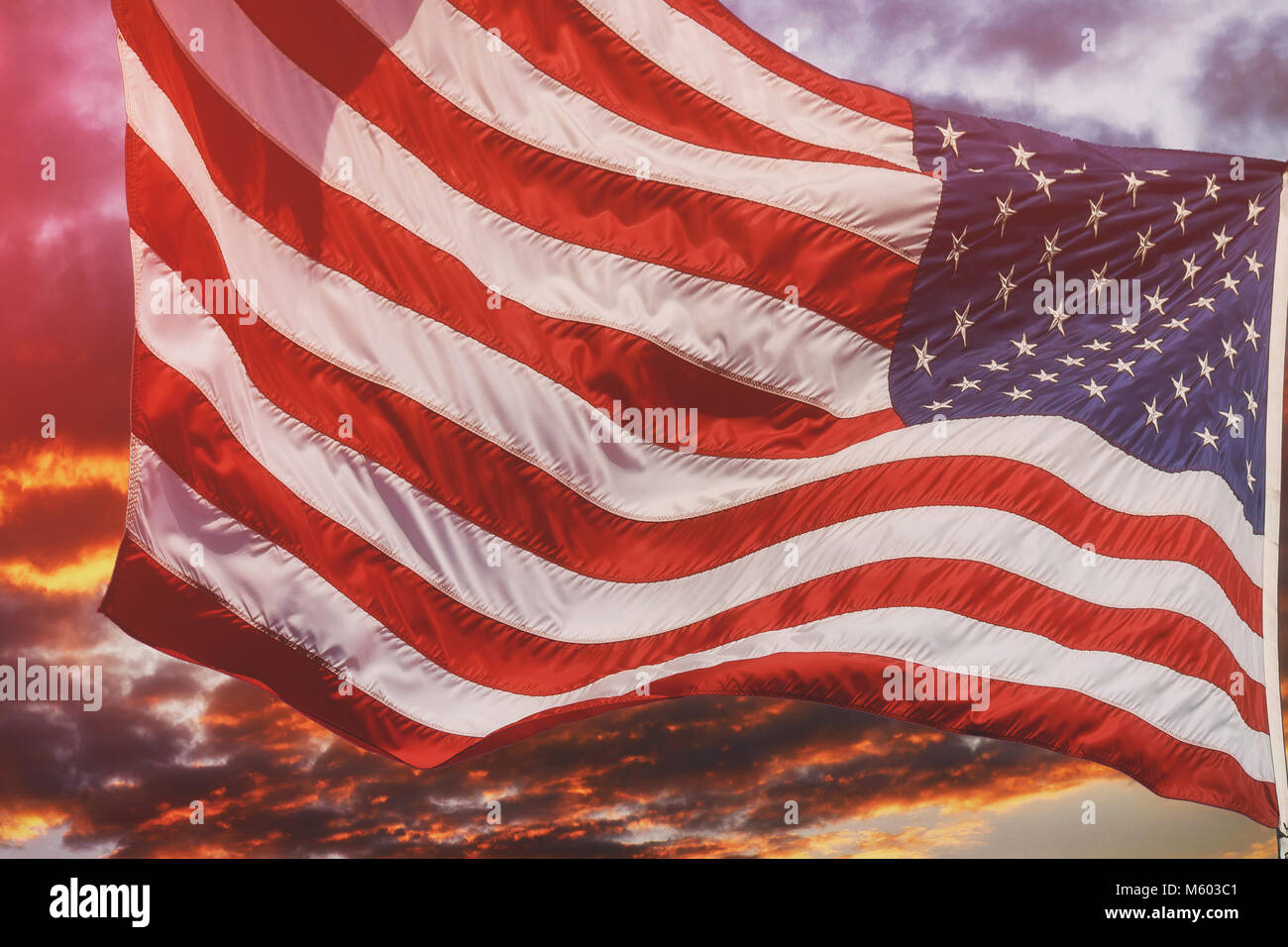 American flag flying, flag USA over beautiful Sunset sunrise with ...