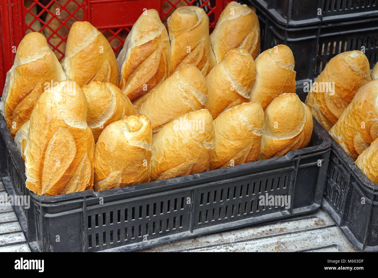 Bread in plastic basket delivery Stock Photo Alamy