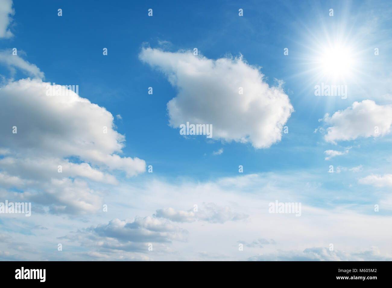 sun on blue sky and clouds Stock Photo