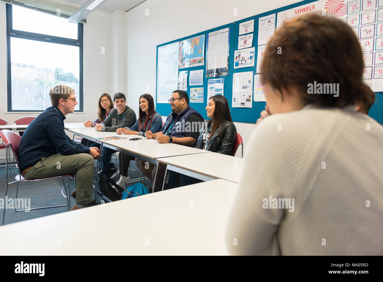 real overseas students learn english at college in the classroom and library of a college / university Stock Photo