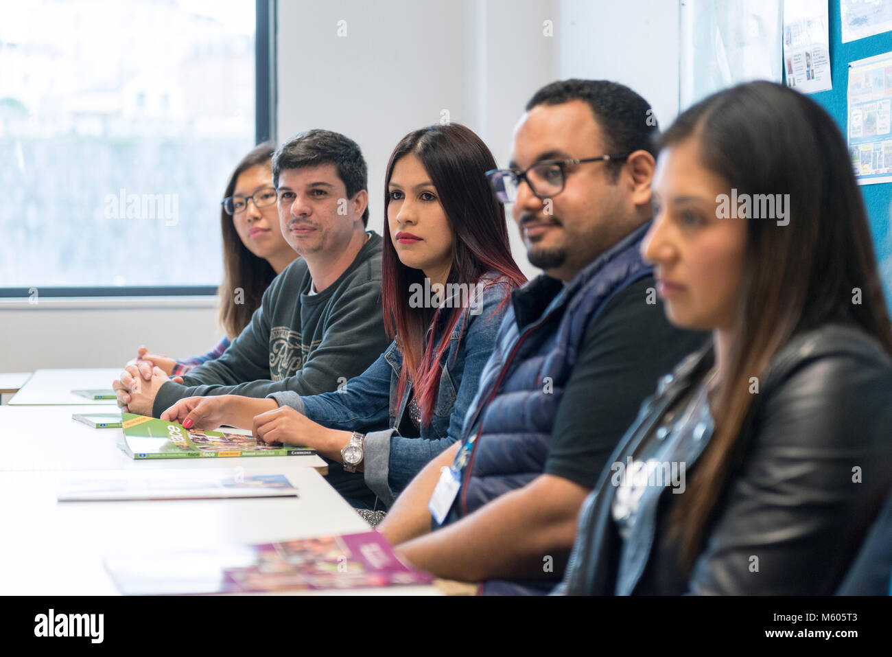 real overseas students learn english at college in the classroom and library of a college / university Stock Photo