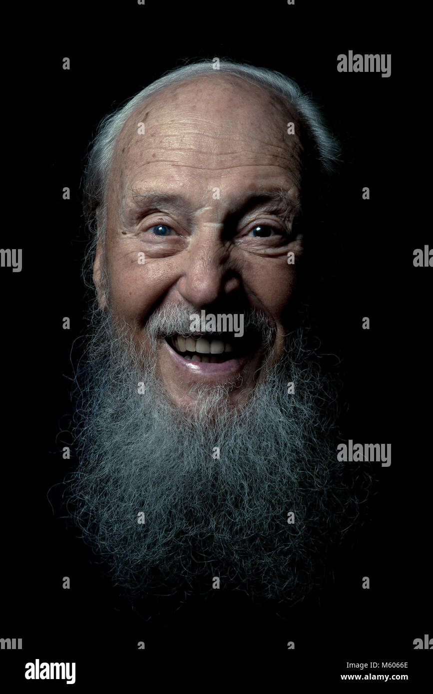 brightons famous oldest gay in the village in close up with a long white beard and a happy face Stock Photo