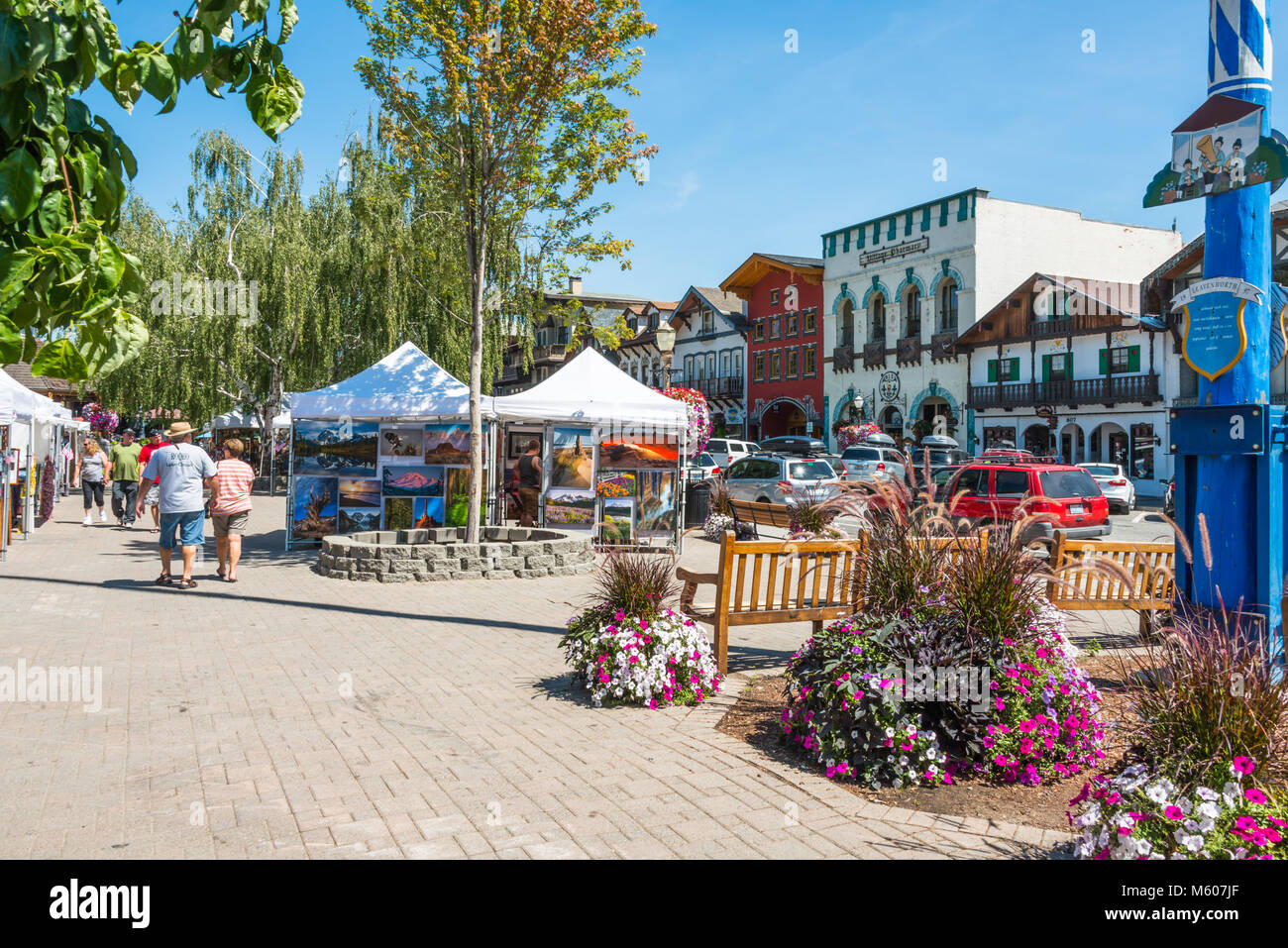 Summer Street Scene with Tourists and Art Fair in Bavarian Themed Tourist Village of  Leavenworth, Washington, in Cascade Mountains Stock Photo