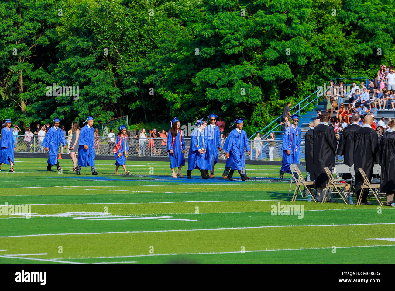 JUNE 17 Sayrevielle NJ USA: Graduates are walking the line to get a diploma and selective focus. Stock Photo