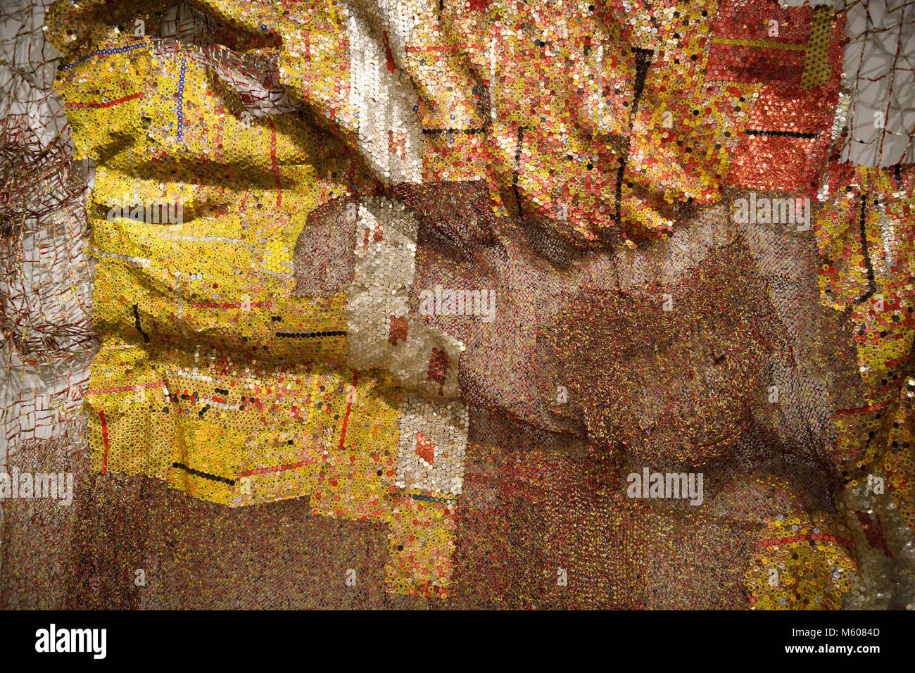 Metal tapestry by African artist El Anatsui using aluminum liquor bottle tops and copper wire at the Toronto Royal Onatario Museum Stock Photo