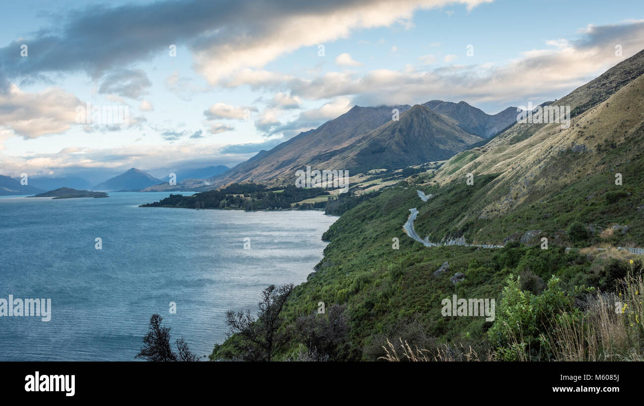 The Road Along Lake Wakatipu on the Drive Between Queenstown and Glenorchy, South Island, New Zealand Stock Photo