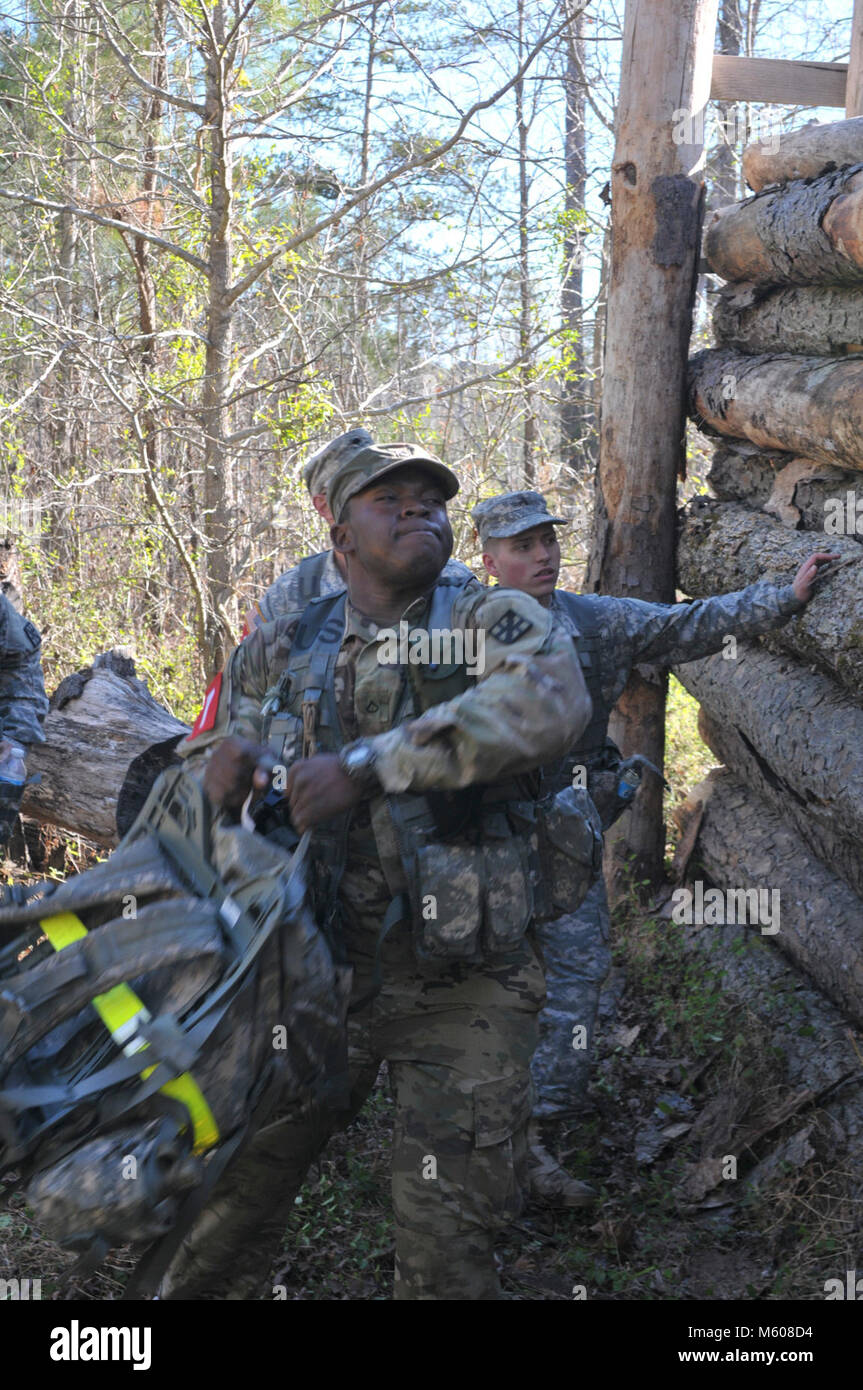 U.S. Army Reserve Pfc. Deven Riles 346th Company, 343rd Battalion throws his rucksack over the obstacle during the 105th Engineer Battalion 2017 Sapper Stakes Invitational at Camp Butner, NC April 9, 2017. Sapper Stakes Invitational pits nine teams of engineers from across the state to battle in a test of strength and skills bringing together the engineer community NC Guard and Reserve Component units. (U.S. Army Stock Photo