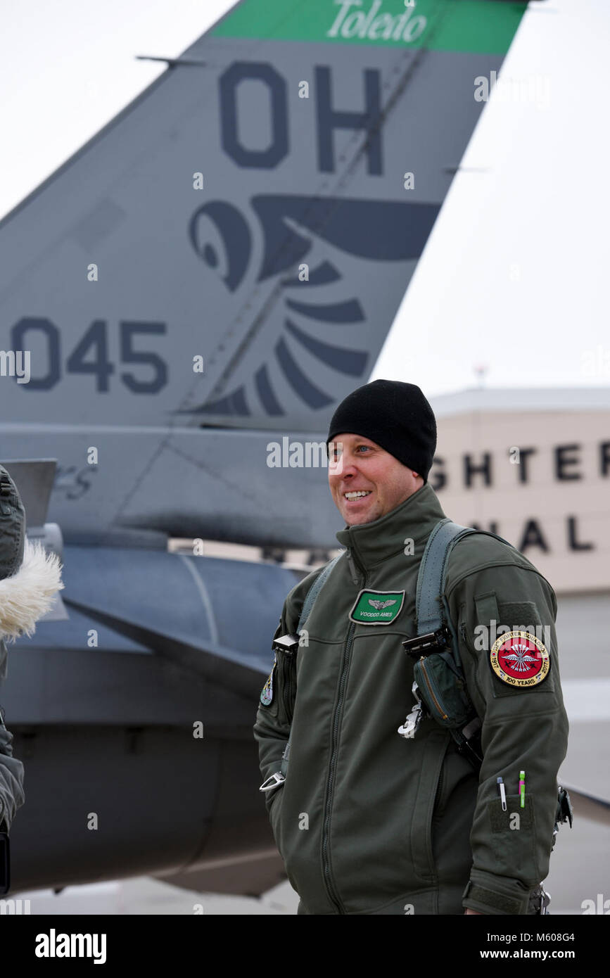 Maj. Jared Ames, an F-16 Fighting Falcon pilot assigned to the 180th Fighter Wing in Swanton, Ohio, prepares to board his aircraft on Jan. 7, 2018. Temperatures throughout January have reached record lows across the country. In Northwest Ohio, the wind chill has consistently been in the -10 to -20 range, even dipping close to -30 at times. Extreme weather situation such as this help prepare Airmen at the 180FW to operate in austere environments. Stock Photo