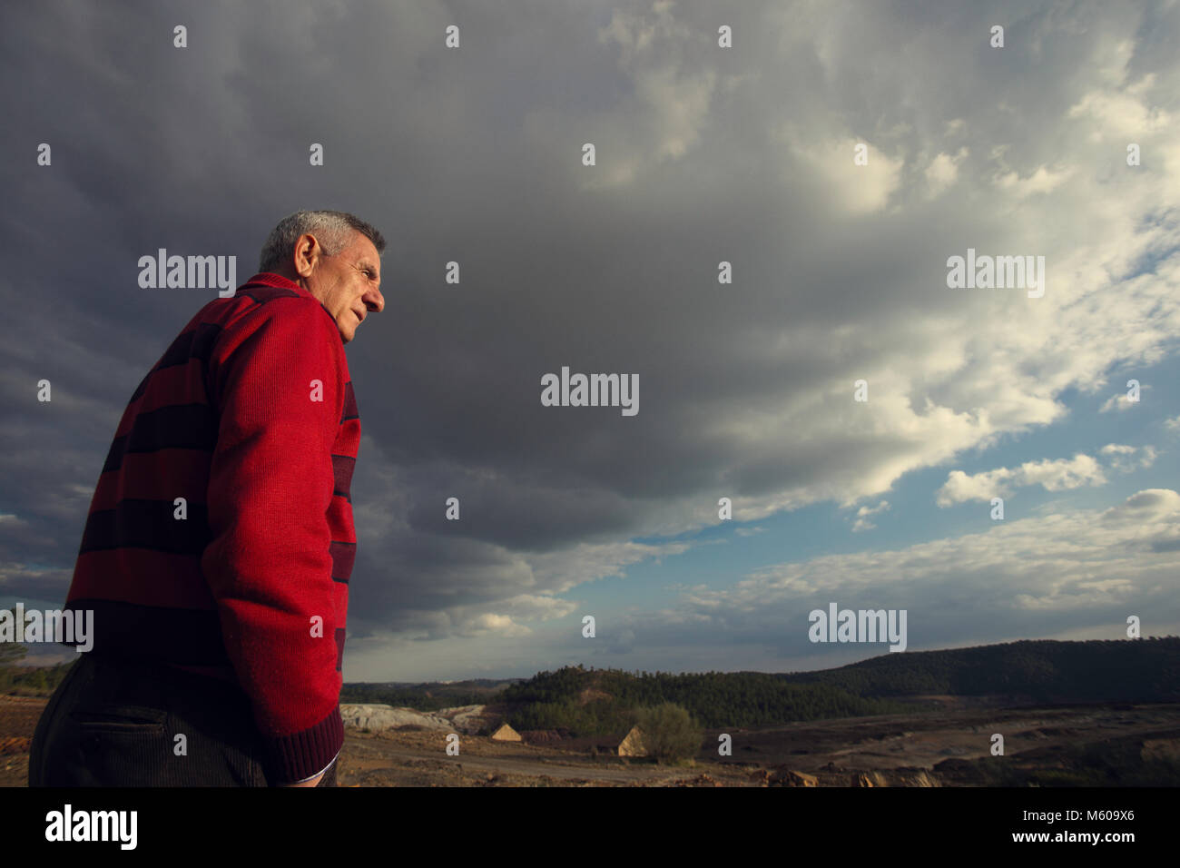 Elderly man contemplating the landscape Stock Photo