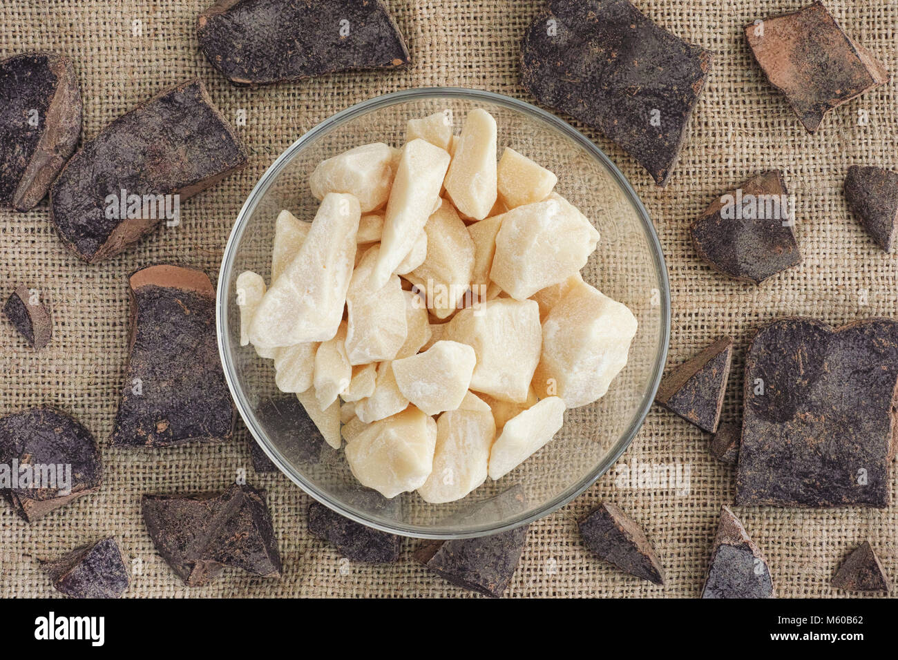 Cacao butter in a bowl and cacao paste. Healthy Organic Food. Close up. Stock Photo