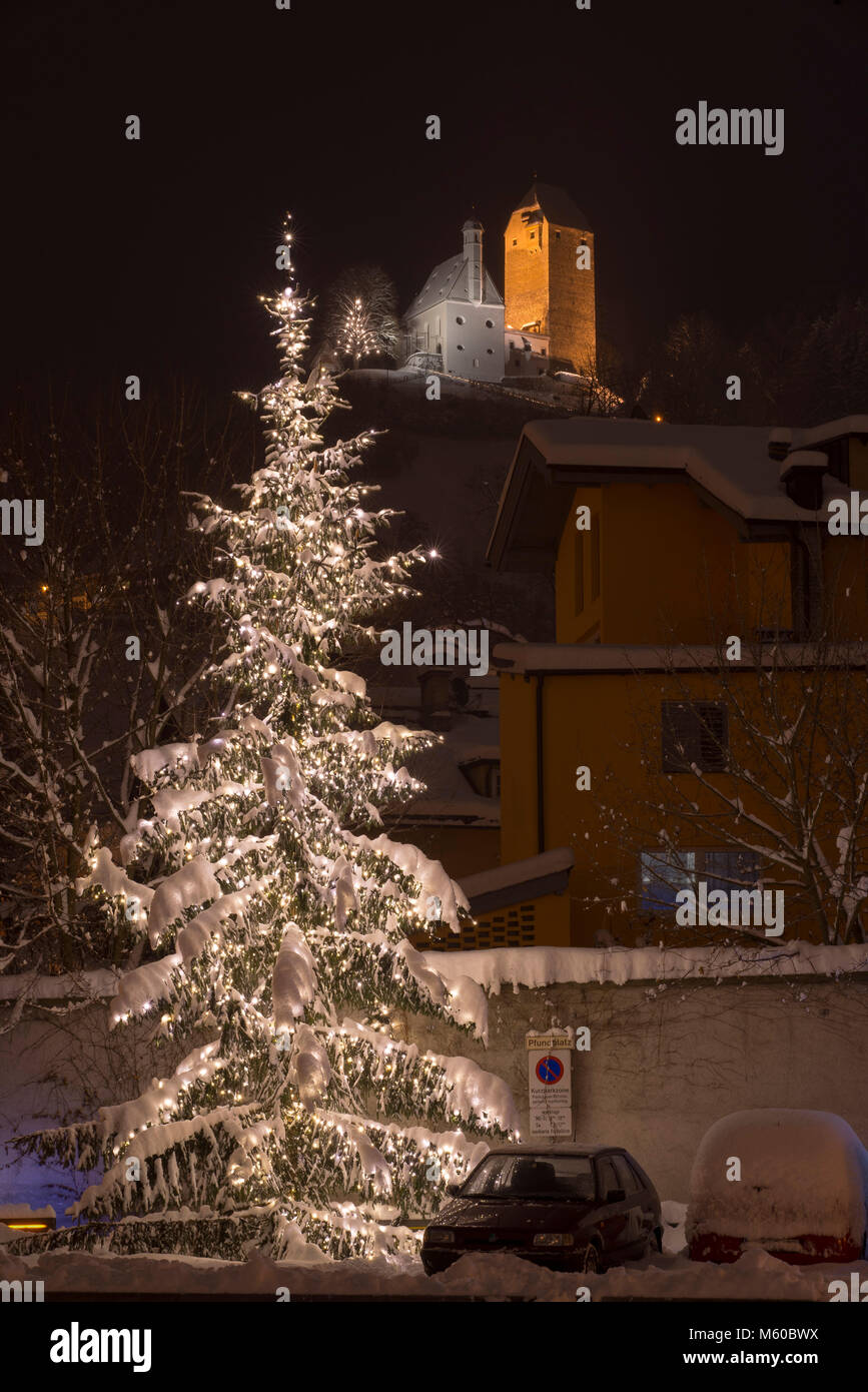 Illuminated Christmas tree with Freundsberg Castle in winter. Schwaz, Tyrol, Austria Stock Photo
