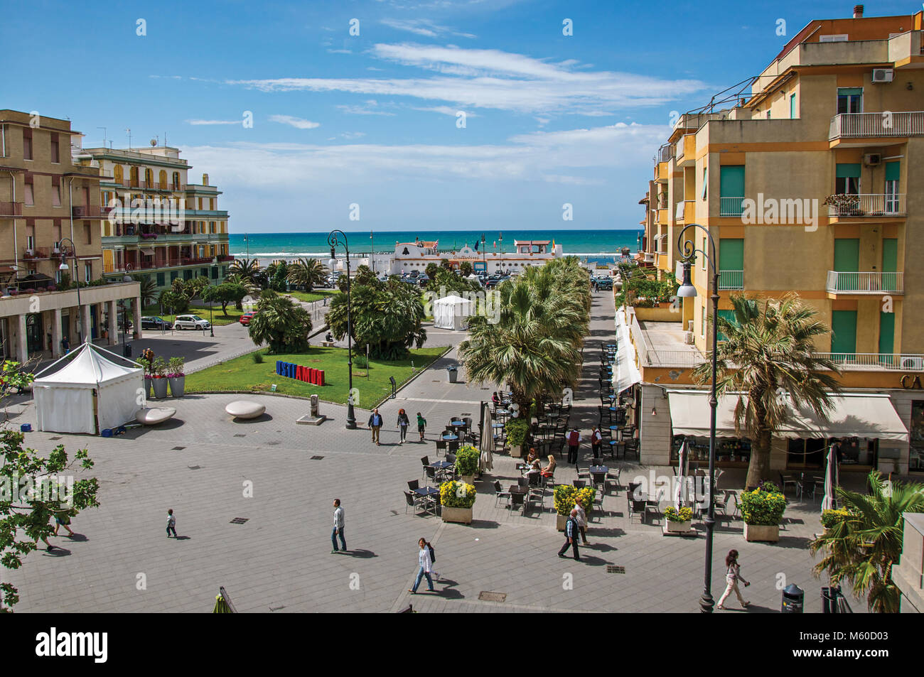 Ostia, Italy. Piazza Anco Marzio, the main square of Ostia, with the Mediterranean sea. The town is a seaside resort and ancient port of Rome. Stock Photo