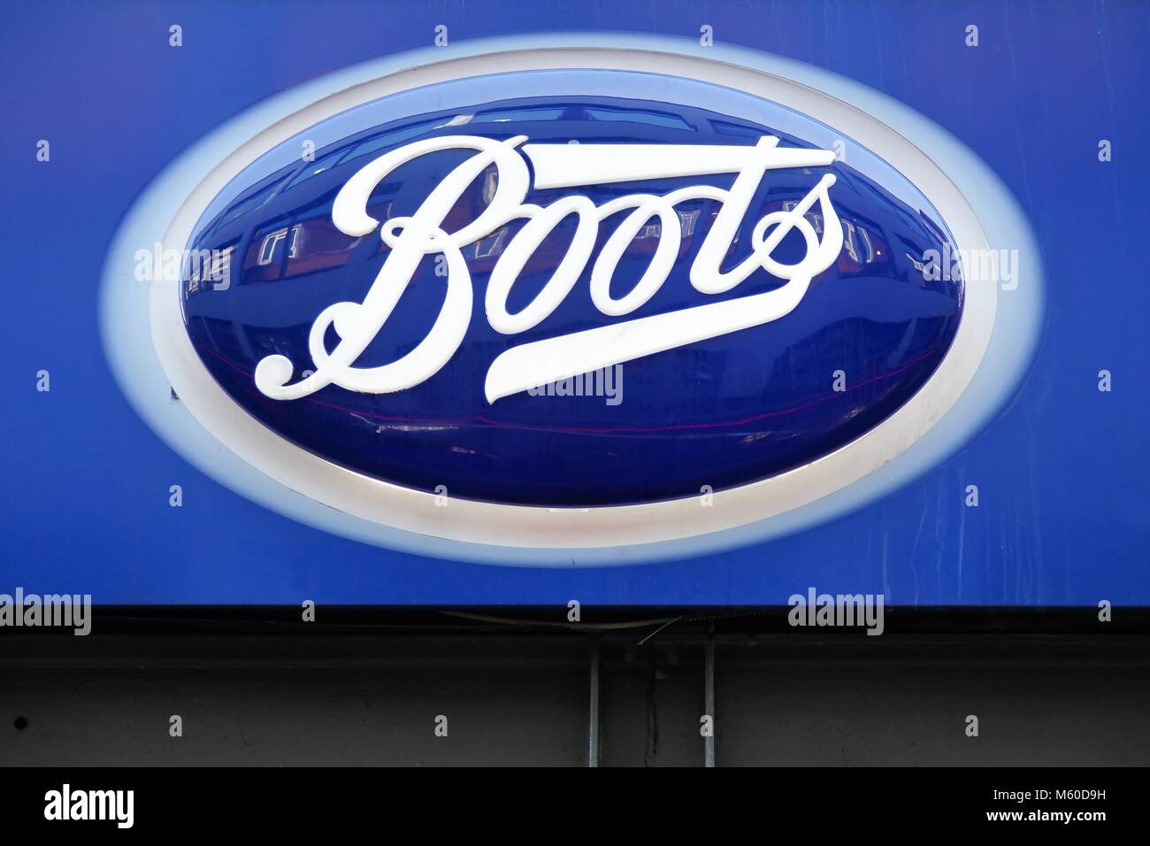 London, United Kingdom - January 31, 2018: Boots logo on a wall. Boots is a pharmacy chain in the United Kingdom, Ireland, Norway, Thailand Stock Photo