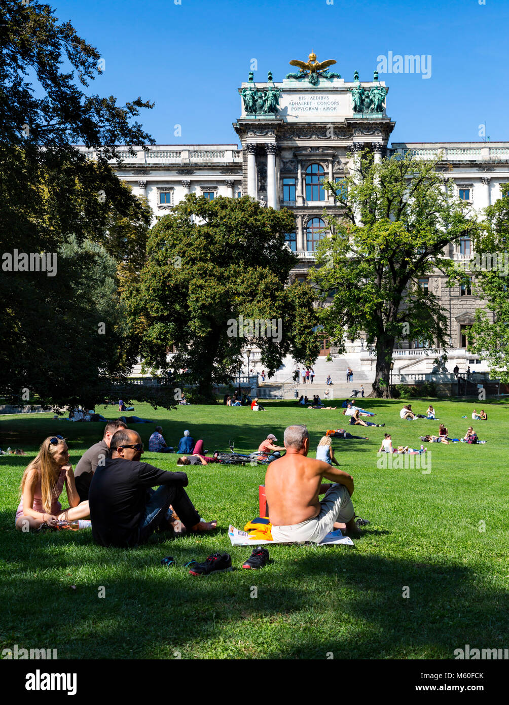 People relaxing at Burggarten Park behind the Neue Burg Palace, Wien, Vienna, Austria. Stock Photo