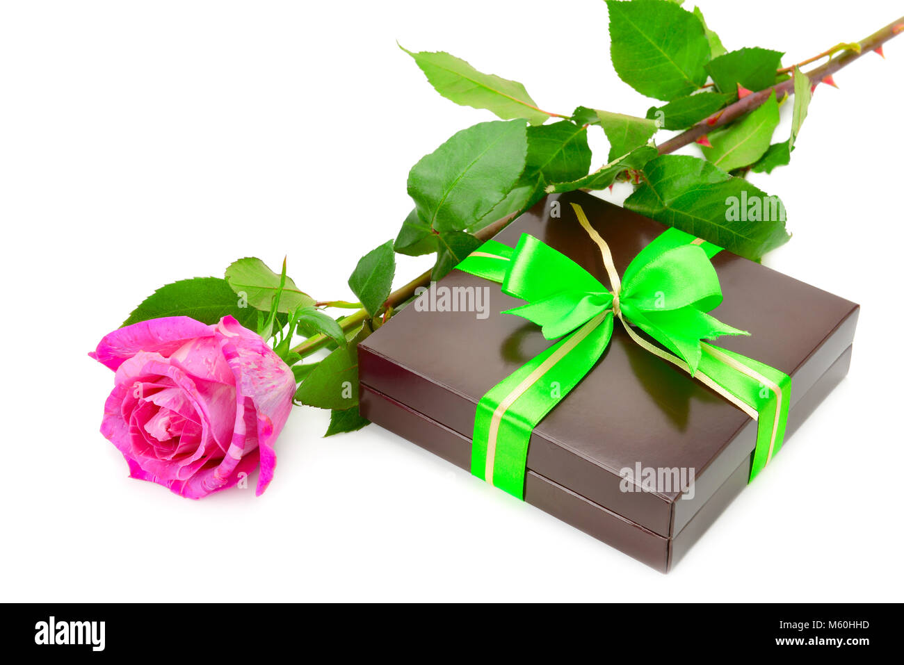 Present and rose isolated on white background Stock Photo