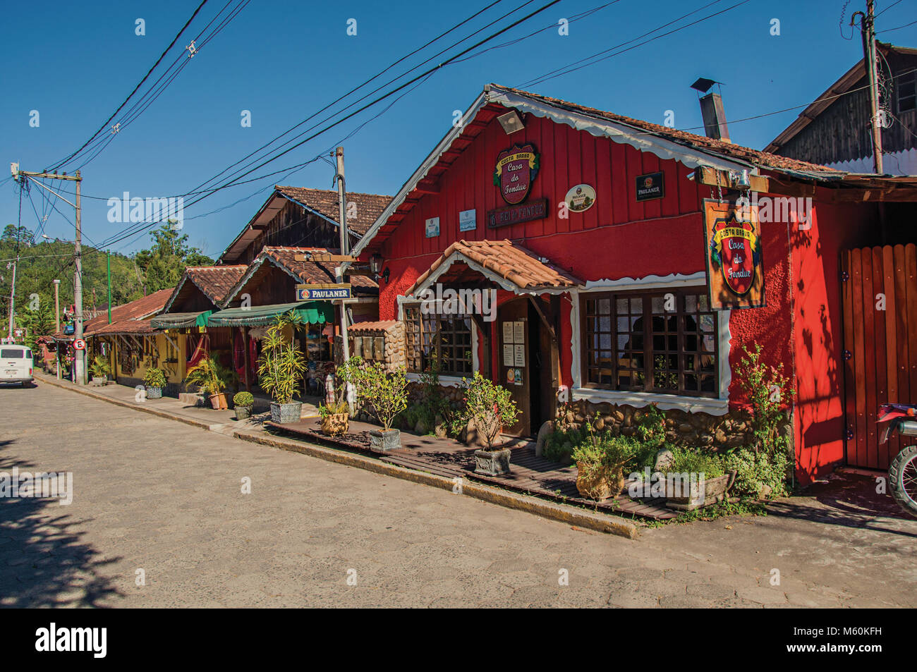 Maringa, Brazil. View of street, colorful houses and blue sky in