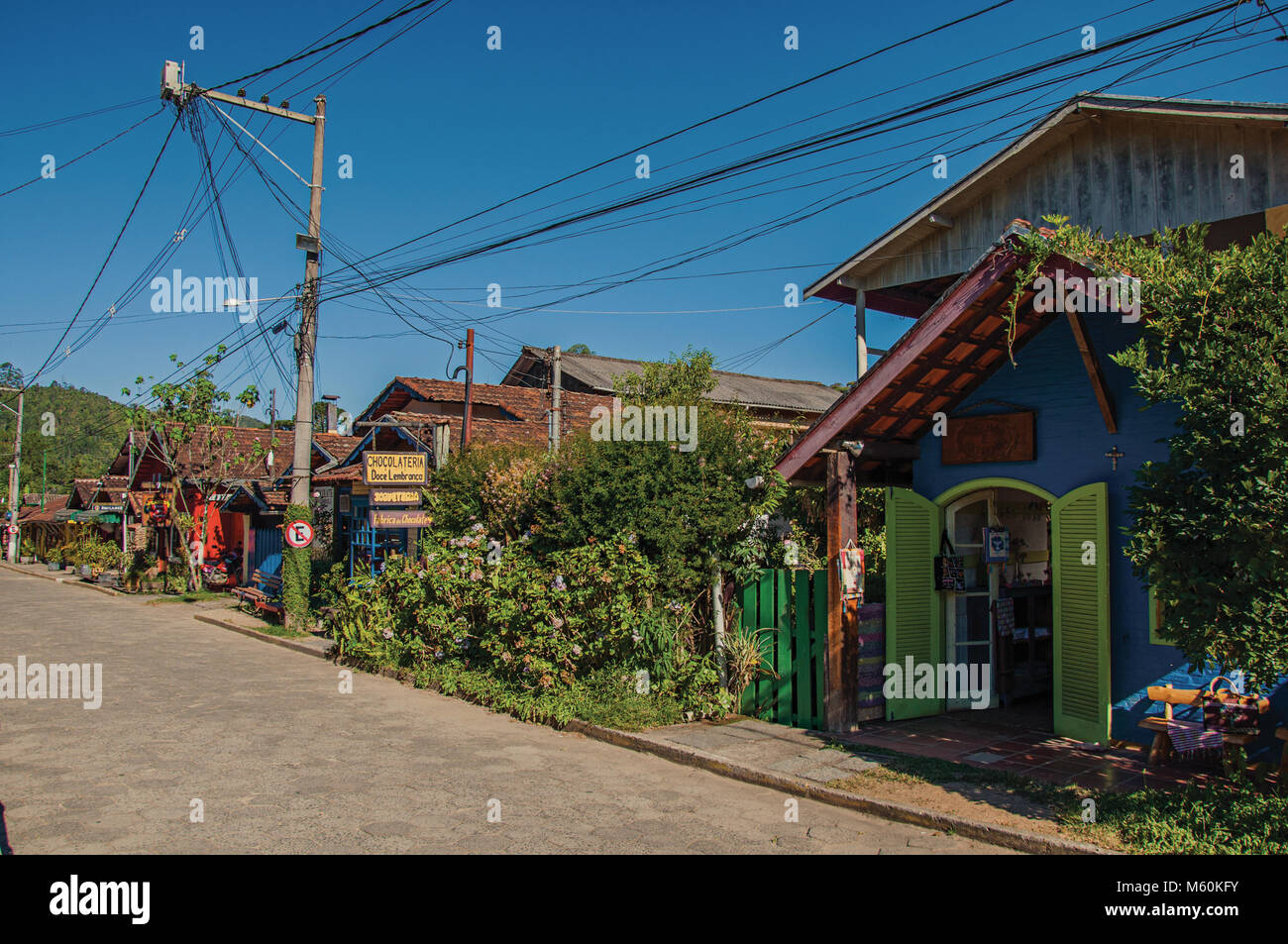 Maringa, Brazil. View of street, colorful houses and blue sky in
