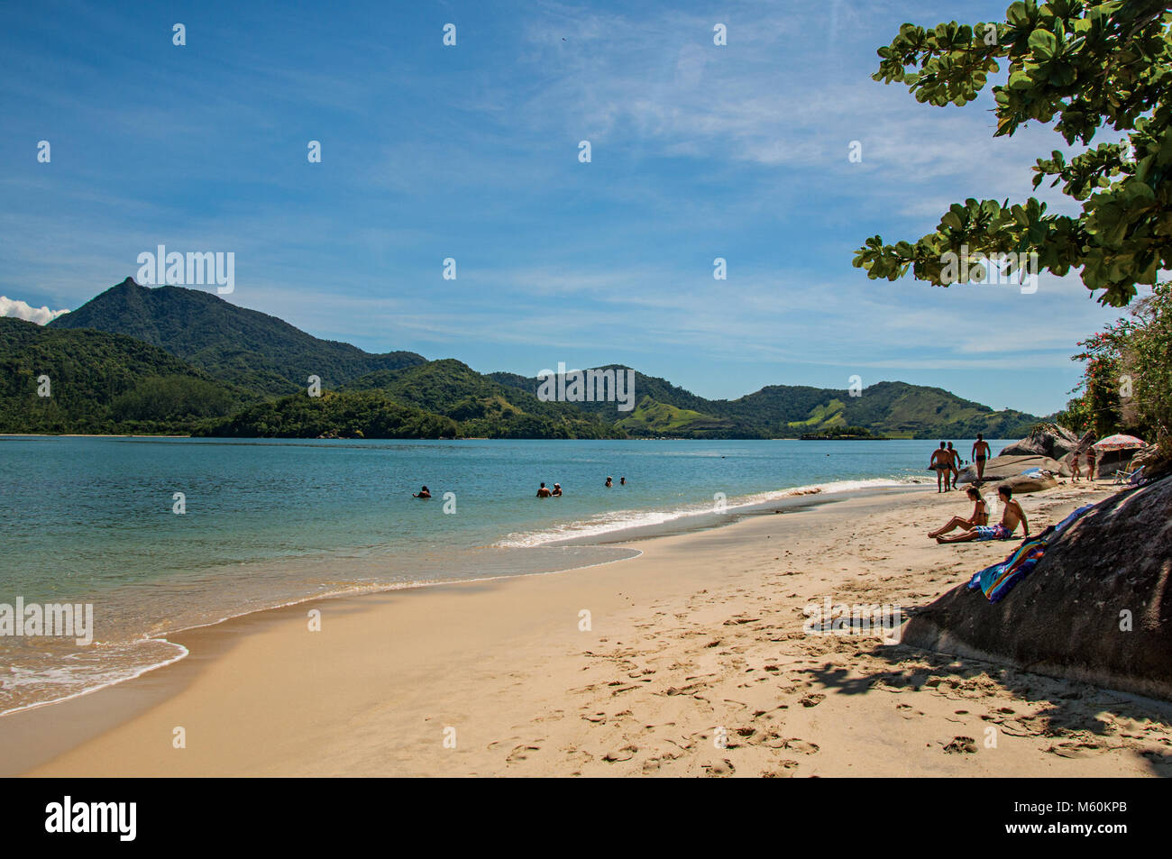 Paraty, Brazil. View of beach, sea and forest on sunny day in Ilha do Pelado, a tropical beach near Paraty, an historic town totally preserved. Stock Photo