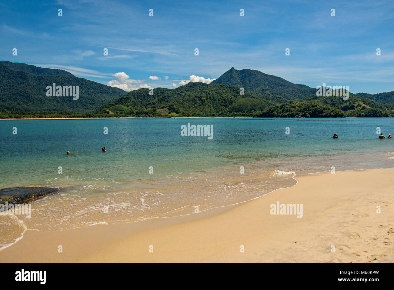 Paraty, Brazil. View of beach, sea and forest on sunny day in Ilha do Pelado, a tropical beach near Paraty, an historic town totally preserved. Stock Photo