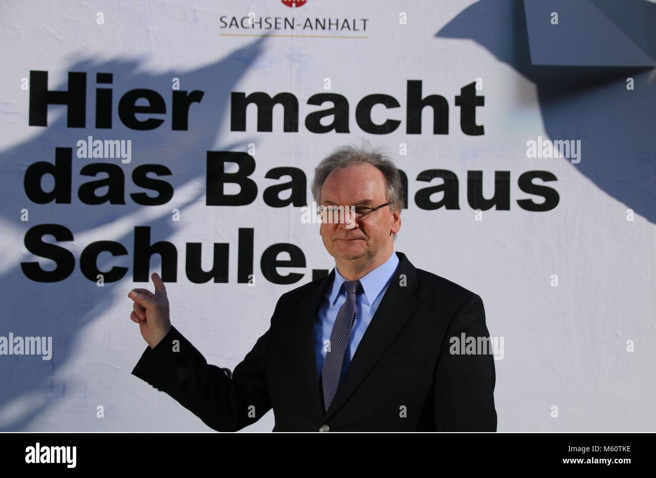 Magdeburg, Germany - February 27,2018: Reiner Haseloff, Prime Minister of Saxony-Anhalt, unveils a sign to draw attention to the Bauhaus anniversary in 2019.16 such signs will be erected along the German motorways. Next year, the world-famous Bauhaus School of Architecture and Art will be one hundred years old. The East German state of Saxony-Anhalt will celebrate the anniversary in Dessau, where the Bauhaus building is located. Famous representatives of the Bauhaus were Walter Gropius, Lyonel Feininger, Johannes Itten, Josef Albers, Paul Klee, Wassily Kandinsky and Oskar Schlemmer. Stock Photo