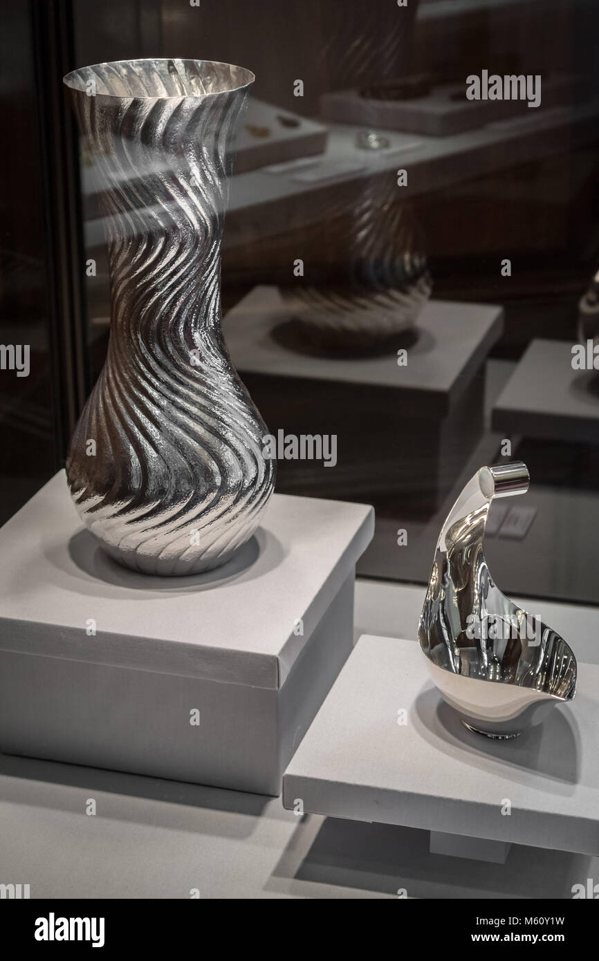 London, UK. 27th Feb, 2018. Goldsmiths' Craftmanship & Design Council Awards Exhibition. Silver Gravy Boat (R) and Wave silver vase (L) by Oscar Saurin. Credit: Guy Corbishley/Alamy Live News Stock Photo