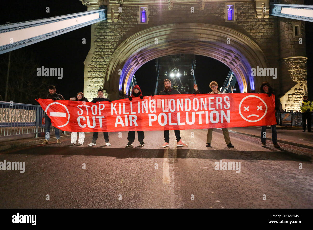 London, UK. 27th Feb, 2018. Campaign group Stop Killing Londoners attempt to block the road at Tower Bridge to bring awareness to air pollution in London. One person was arrested for alleged non payment of fines. The group then stood on Tower Bridge bringing traffic to standstill for a few minutes. Penelope Barritt/Alamy Live News Stock Photo