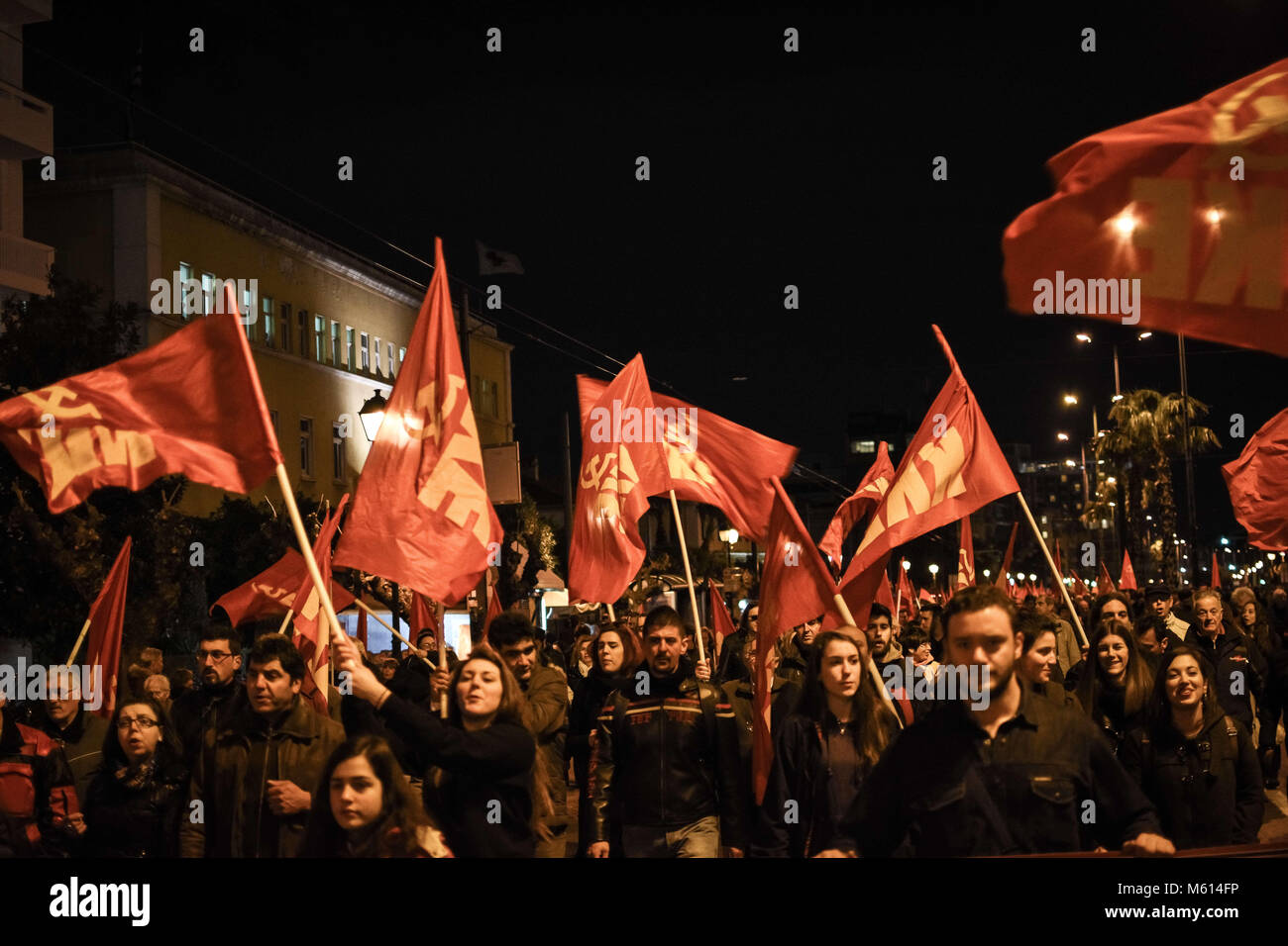 Athens, Greece. 27th Feb, 2018. People holding flags during the demonstration.Demonstration at Syntagma Square in Athens as general secretary of the Communist Party of Greece delivers a speech on developments in the Balkans, the Middle East and the Greek-Turkish relations. Credit: N Kokovlis 27.2.2018 12 .jpg/SOPA Images/ZUMA Wire/Alamy Live News Stock Photo