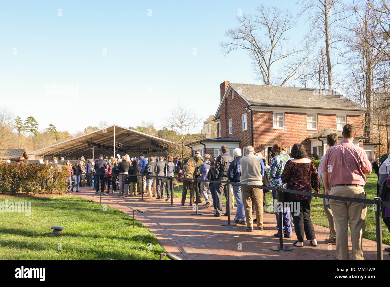 Charlotte, NC, USA. 27 Feb, 2018. Visitors line around the beautiful Billy Graham Library campus to pay their respects to the Reverend who died on 21 Feb 2018.  Rev. Graham's funeral will occur on Friday  followed by a gravesite service. He will be buried beside his wife Ruth in the Prayer Garden at the Billy Graham Library in Charlotte. Credit: Castle Light Images / Alamy Live News. Stock Photo