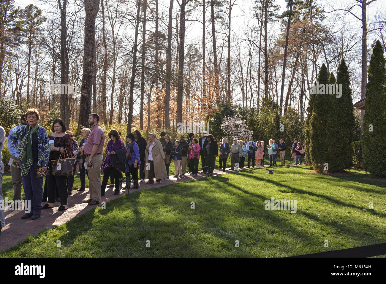 Charlotte, NC, USA. 27 Feb, 2018. Visitors line around the beautiful Billy Graham Library campus to pay their respects to the Reverend who died on 21 Feb 2018.  Rev. Graham's funeral will occur on Friday  followed by a gravesite service. He will be buried beside his wife Ruth in the Prayer Garden at the Billy Graham Library in Charlotte. Credit: Castle Light Images / Alamy Live News. Stock Photo