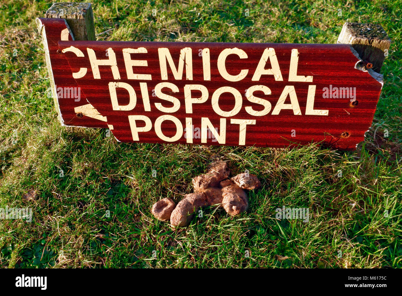 Chemical Disposal Point sign at a caravan and camping site with a pile of  dog poo at the sign!toilet waste Stock Photo - Alamy