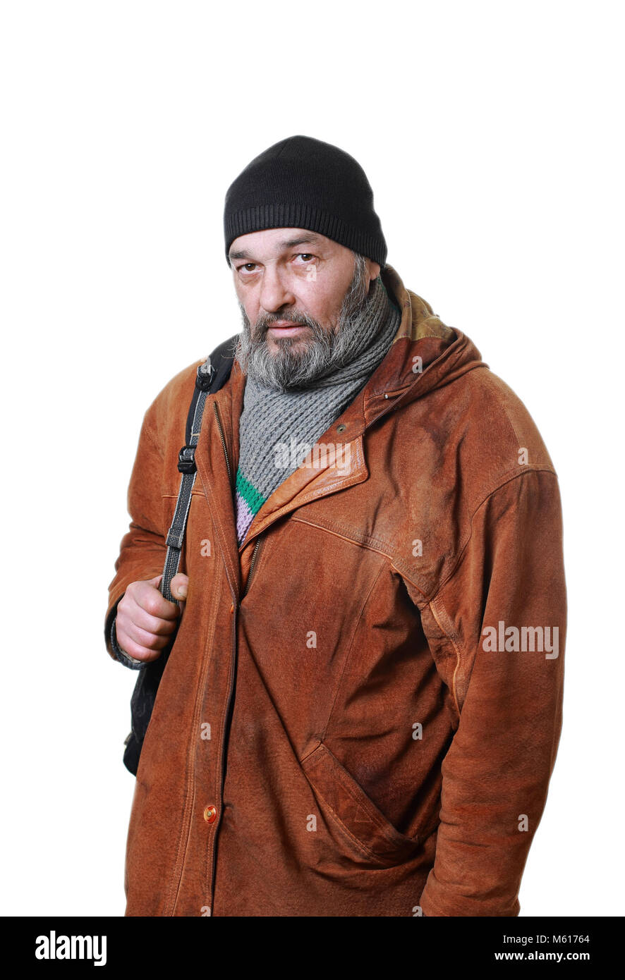 Real man with a beard in a hat and scarf in a brown leather jacket, with a bag on a white background Stock Photo