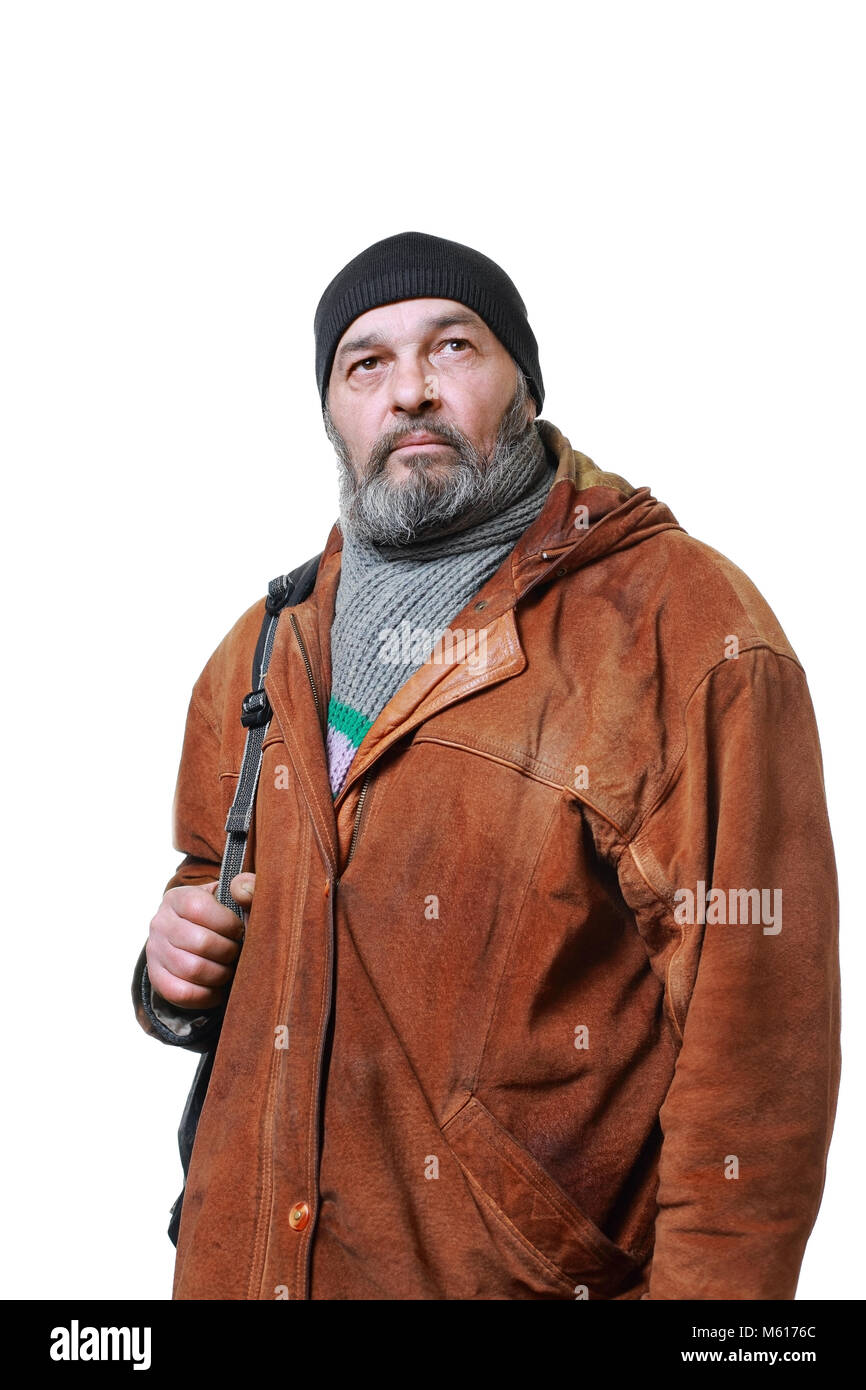 Real man with a beard in a hat and scarf in a brown leather jacket, with a bag on a white background Stock Photo