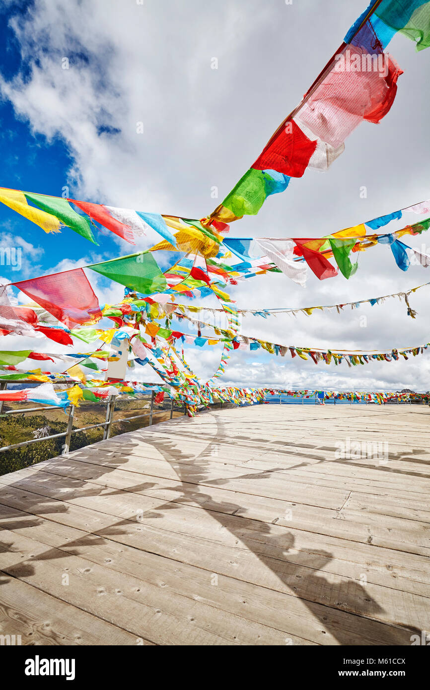 Buddhist prayer flags in the Shika Snow Mountain scenic area, Yunnan Province, China. Stock Photo