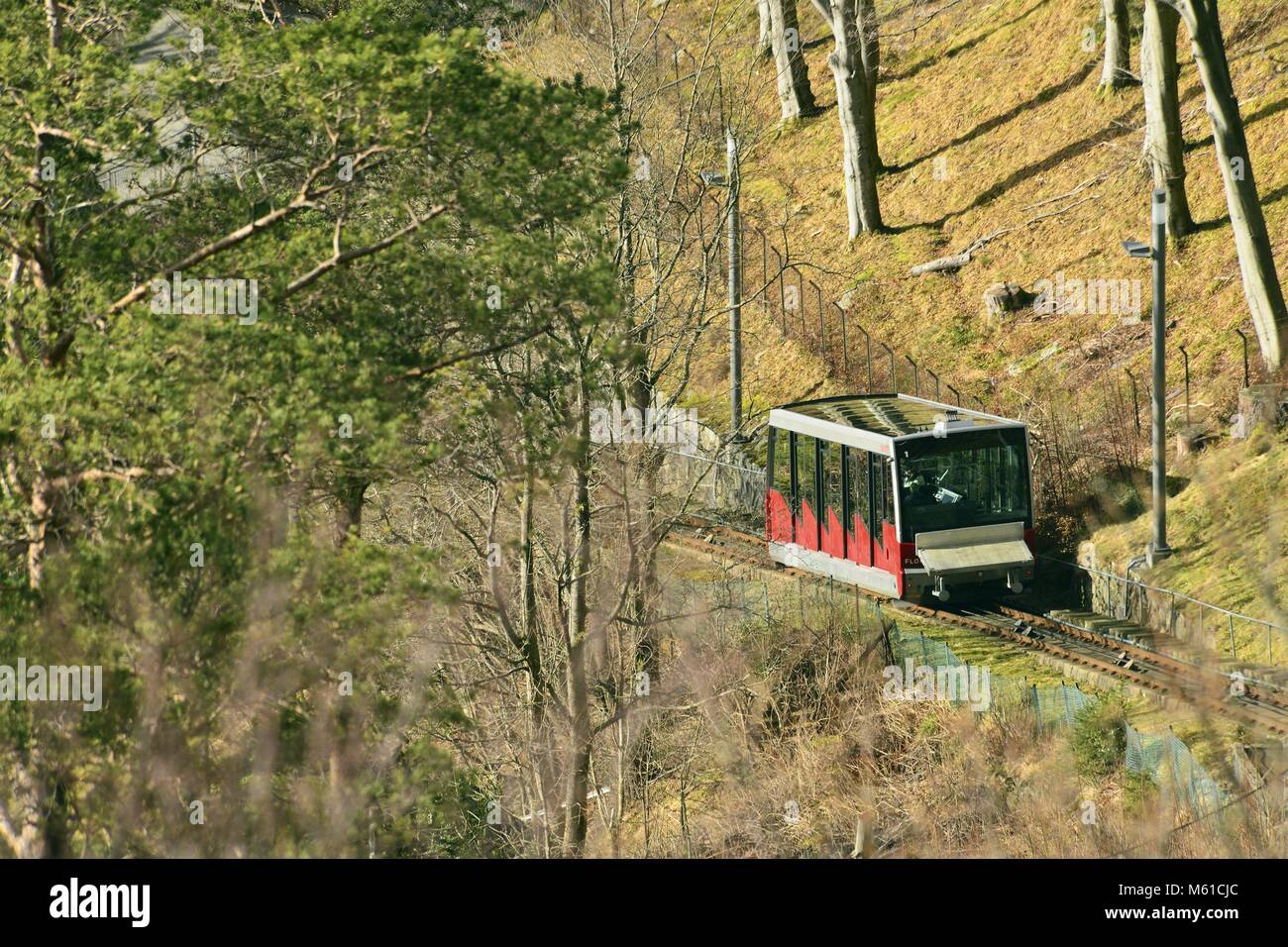 Red Funicular Train The red wagon from the funicular railway Fløibanen during it's trip to ...