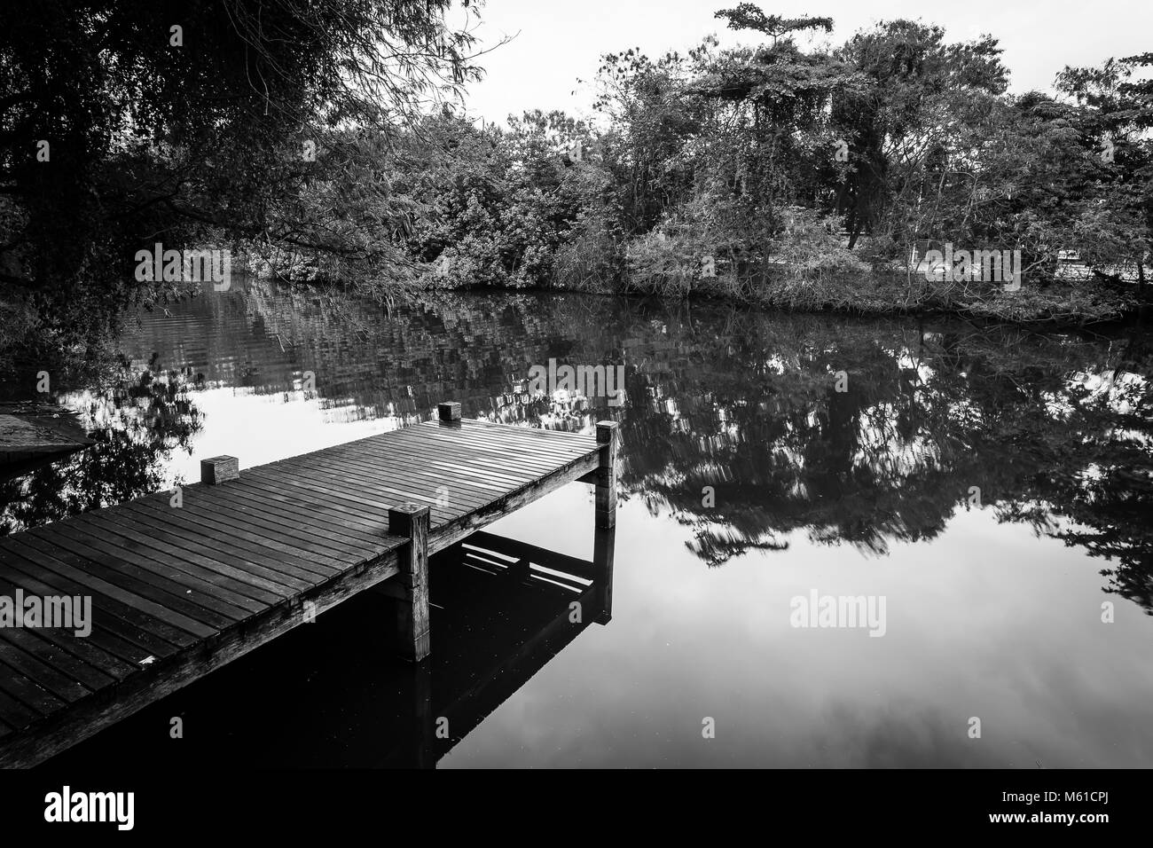 Long exposure of deck in lake, cloudy skies. Barra da Tijuca, rio de janeiro Stock Photo