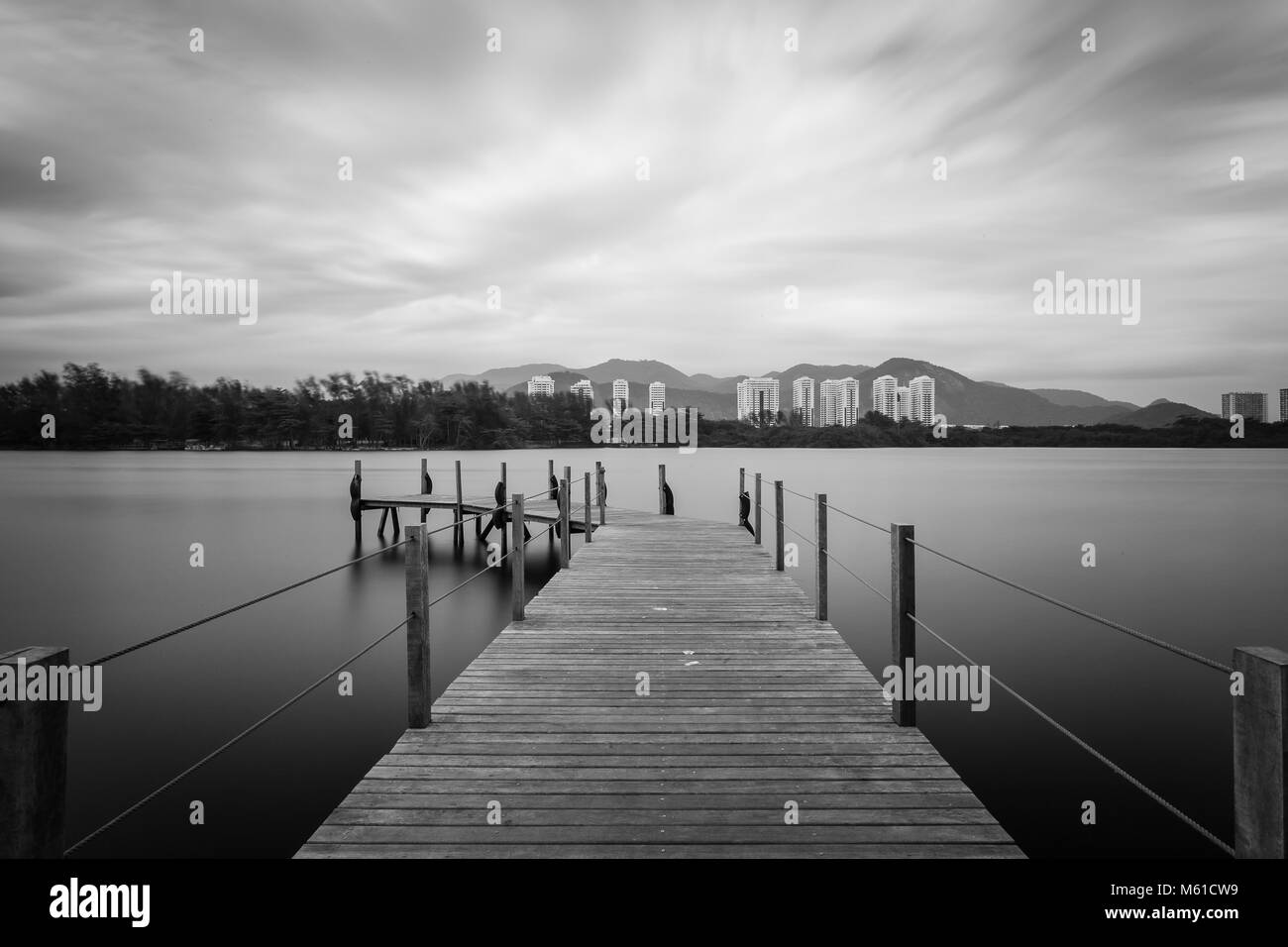 Long exposure of deck in lake, cloudy skies. Barra da Tijuca, rio de janeiro Stock Photo